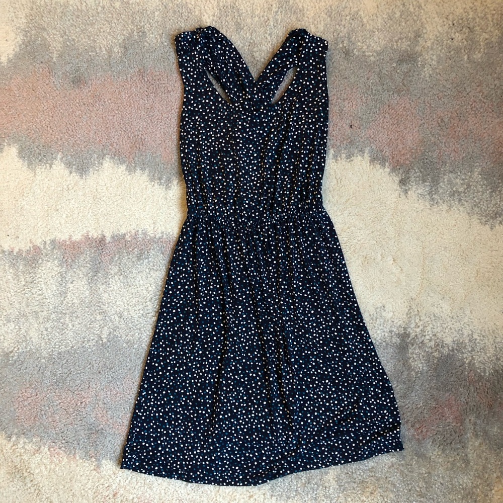 Navy blue polka dot mini dress with crossed back
